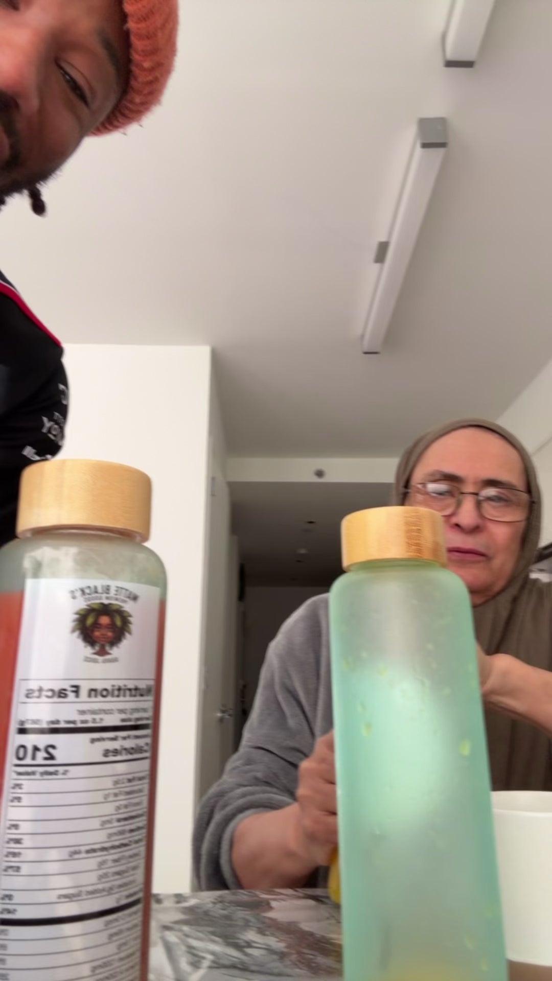 my second mum tries the guava juice, jamu, and the orange juice!